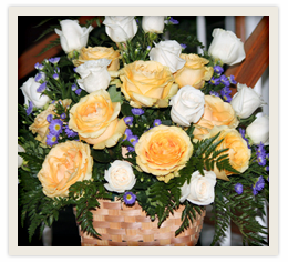 Peach Roses in a Basket Arrangement